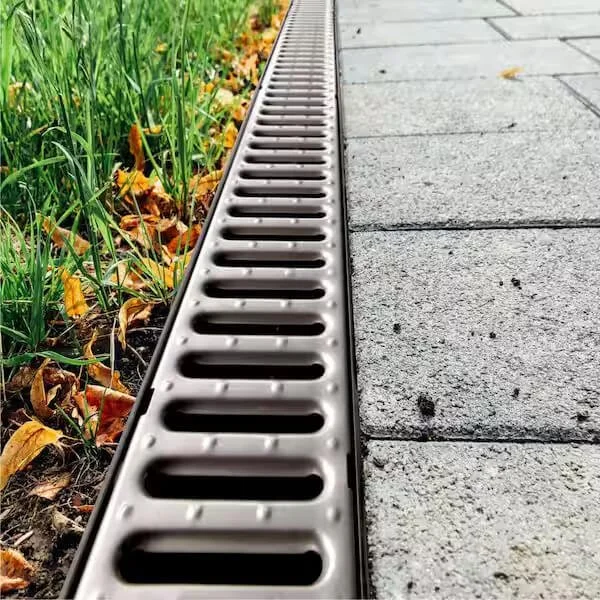 Channel drain grate professionally installed at a Houston TX property