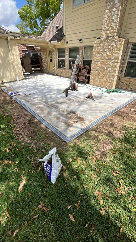 Professional channel drain installation on a Houston TX patio