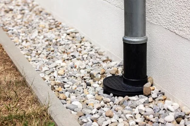 Gravel drainage area around a downspout needing cleaning in Houston TX